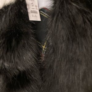 JCrew faux black fur poncho wrap in plaid colors.